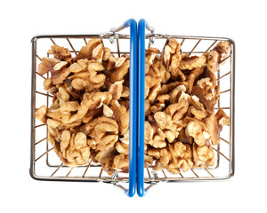 Shelled walnuts in a small shopping basket top view. Isolated on white background