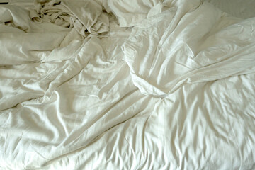 white wrinkled texture background , Soft white fabric, crumpled from the bed sheet