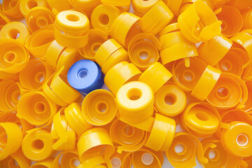Plastic yellow caps fill the entire frame, one blue among the yellow. Another. Stand out.