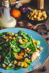 Shot of a green salad with fruit