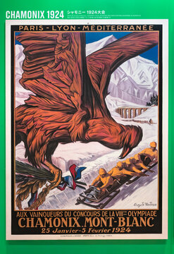 tokyo, japan - august 10 2021: French poster of Chamonix 1924 winter olympics games depicting an eagle soaring above a bobsleigh track in Alps exhibited at Olympic Agora exhibition in Coredo.