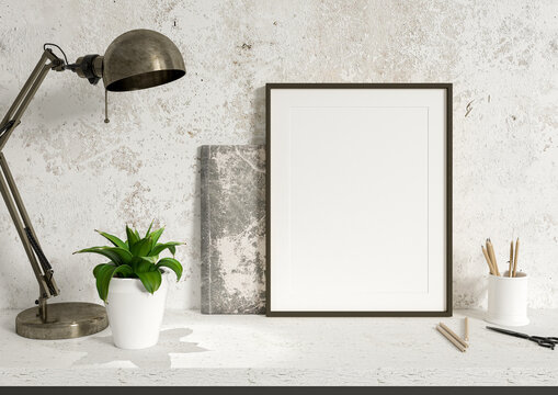 Single 8x10 Vertical Black Frame mockup on a concrete wall with vintage lamp and plant. Loft style frame mockup with pencells and sketchbook. 3D Rendering