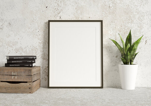Single 8x10 Vertical Black Frame mockup on a concrete wall with plant and wooden crate. Loft style frame mockup with books. 3D Rendering