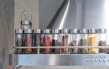 Glass jars with various spices. Food storage concept.