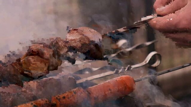 Barbecue pieces of pork. Shashlik. The process of frying meat on the grill. Slow motion. Smoke from fire. Cooking barbecue in nature. Boiling fat on pork. Holidays of the CIS. 1st of May. Shashlyk