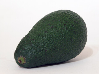 green avocado on white background