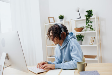 portrait of a man in a blue jacket in front of a computer internet online Lifestyle