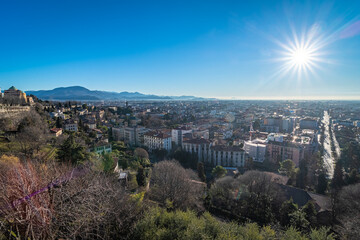 The lower city of Bergamo bassa view from the Saint James Gate in the upper city at sunset, Italy, Europe