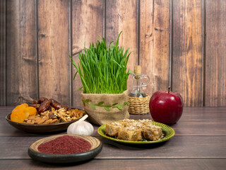 Festive table in honor of Navruz. Wheat with a red ribbon, the traditional holiday of the vernal equinox Nawruz