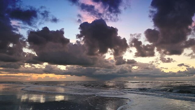Sunset at the North Sea beach after a stormy autumn day at Texel island in the Dutch Waddensea region in The Netherlands.