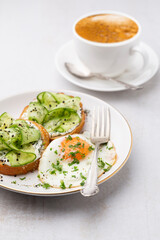 Keto Toasts with ricotta, egg, cucumber and black sesame.