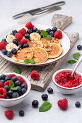 Keto diet pancakes made or almond flour, served with berries.