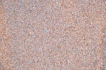 Flat view of clean yellow sand surface covering seaside beach. Sandy texture