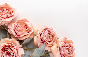 Flowers composition. Bouquet of pink roses in pastel colors. Flatlay.