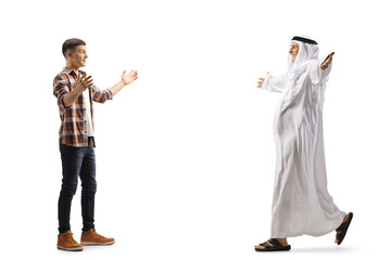 Full length profile shot of an arab man walking with open arms towards a casual young man