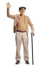 Full length portrait of a smiling elderly gentleman standing with a cane and waving
