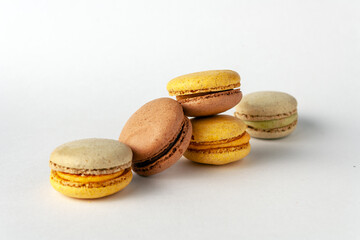 colored macaroons on a white background, copy space