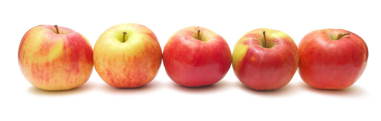 Five apples on an isolated white background. Panoramic photography.