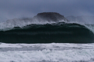 Winter wave storm watching Chesterman Beach, Tofino, Vancouver Island, B.C., Canada.