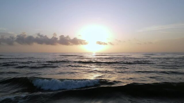 2022 - Excellent aerial view of the tide coming up on New Smyrna Beach, Florida at sunrise.