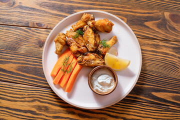 Menu design concept. Baked chicken legs with lemon and carrots.