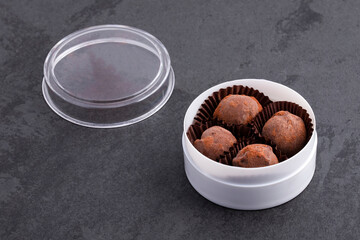 Delicious chocolate truffles in the plastic bowl