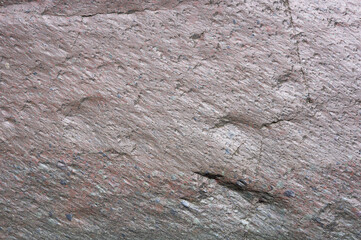 Red rocks background stony surface after rain