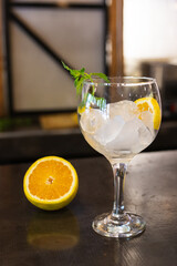 glass with ice and orange slices