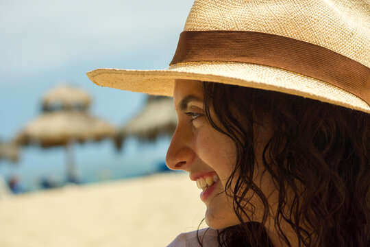 Beautiful girl smiling under the sun