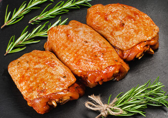 Convenience food, precooked.Background for a banner of meat with spices.Raw Marinated chicken thighs with spices for cooking for BBQ . Top view.