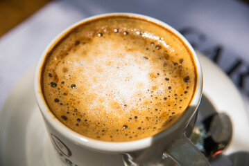 coffee with sparkling milk on a plate