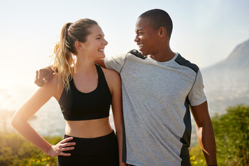 Fototapeta premium I can always count on you to keep me motivated. Shot of a fit young couple working out together outdoors.