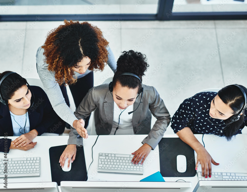 Wall mural commitment always shows from every employee on our side. high angle shot of a group of women working