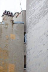 Fototapeta na wymiar facade of a house with windows walled off