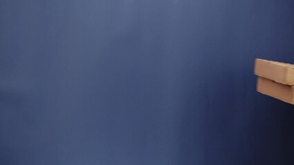 Square cardboard boxes on blue background. Preparing take away meals. Online contactless food shopping. Food delivery service. Courier in protective gloves giving order, delivering to customer. 