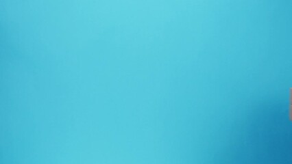 Square cardboard boxes on blue background. Preparing take away meals. Online contactless food shopping. Food delivery service. Courier giving order, delivering to customer. 