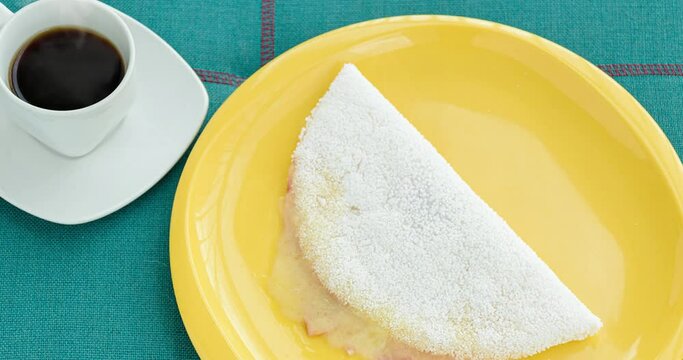 Cup with coffee and tapioca with muzzarella cheese and ham (top view)