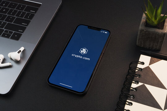 Crypto.com (cryptocurrency exchange) app on the smartphone screen on black background table. Office environment. Rio de Janeiro, RJ, Brazil. February 2022