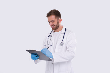 Man Doctor Writing in Clipboard Isolated. Doctor with Clipboard. Commecial, Shopping, Advertisment Concept Isolated