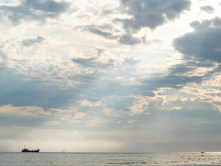 Fishing boat returning to harbour at sunset