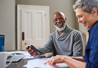 Financial planning has done them the world of good. Cropped shot of a senior couple working on their finances at home.