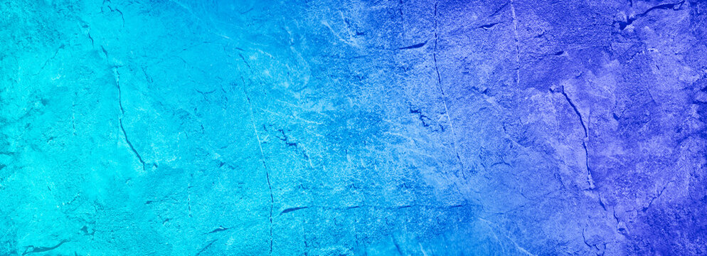 Turquoise purple abstract background. Gradient. Old painted rough wall surface texture. Close-up. Colorful backdrop with copy space for design. Wide banner. Panoramic.