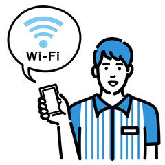 スマホを持ってWi-Fiの説明をしているコンビニ店員の若い男性
