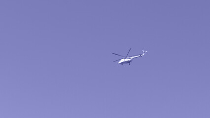 Obraz premium Helicopter against the sky, purple toning. Military theme