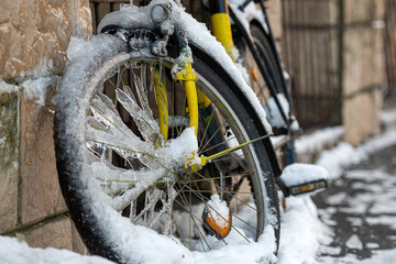 close-up of a bicycle wrapped in ice and icicles - Powered by Adobe