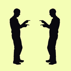 silhouette of a man pointing to the side with both hands. the whole body of the person is seen with the arms and pointing with the fingers to the right and left.
