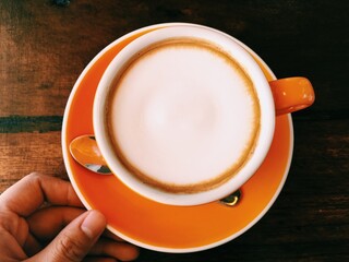 cup of coffee in hand