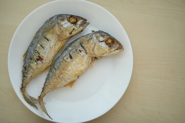 fried fish on white plate