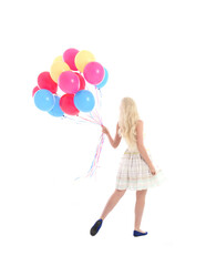 Obraz na płótnie Canvas Full length portrait of blonde girl wearing party dress, holding bunch of colourful balloons. Isolated on white studio background