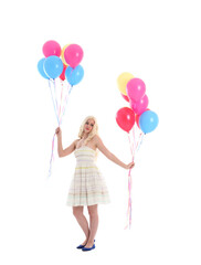 
Full length portrait of blonde girl wearing party dress, holding bunch of colourful balloons. Isolated on white studio background